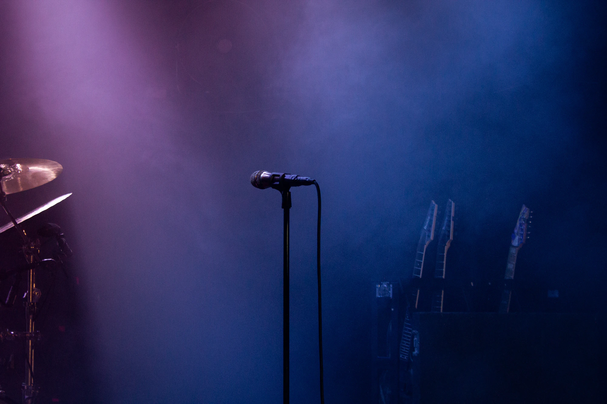 A microphone on a softly lit stage